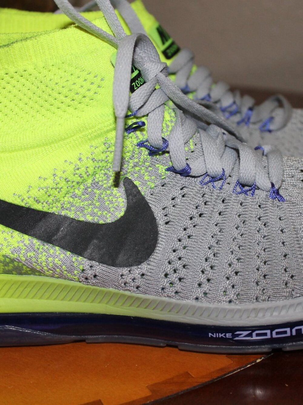 Nike neon yellow ankle height shoes.
